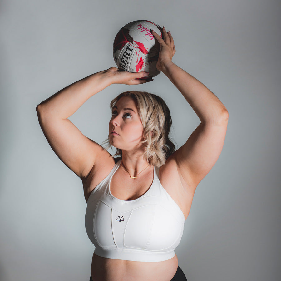 Eleanor Cardwell wearing White Maaree solidarity high impact sports bra for netball